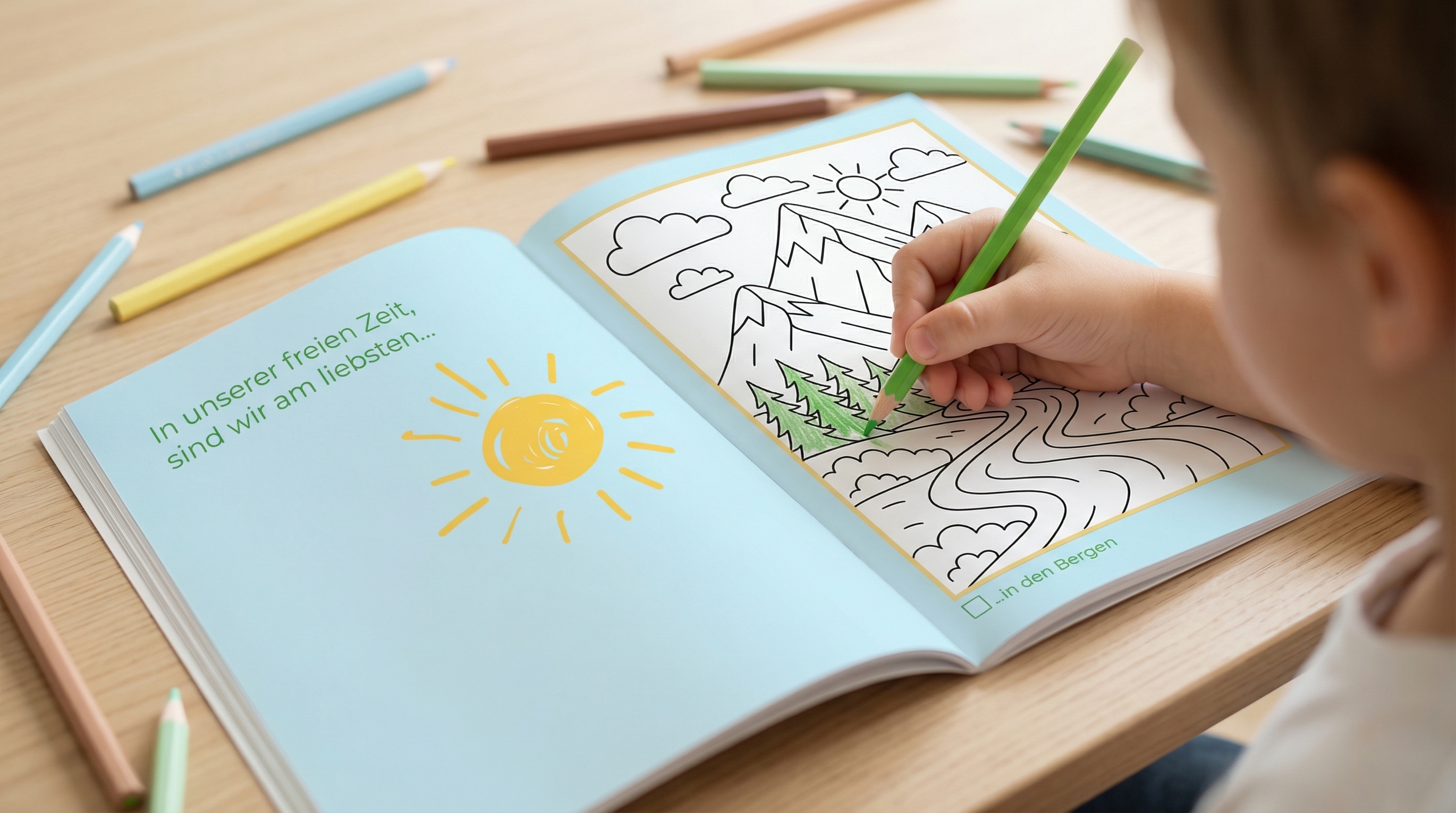 Kind malt Berglandschaft im Buch aus